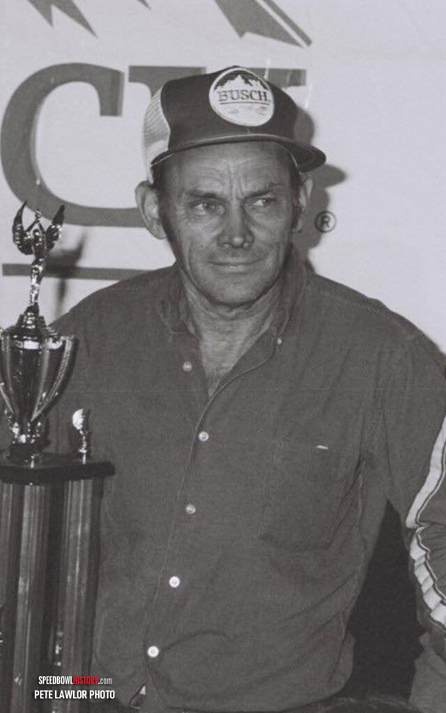 Black and white abstract pattern with concentric circles and wave shapes.