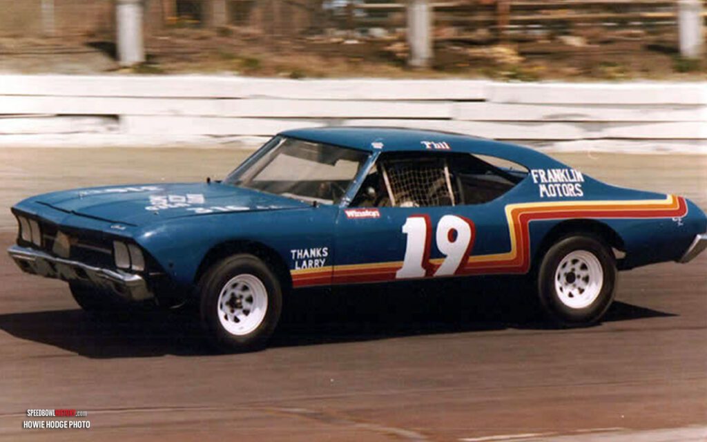 Black and white abstract pattern with concentric circles and wave shapes.