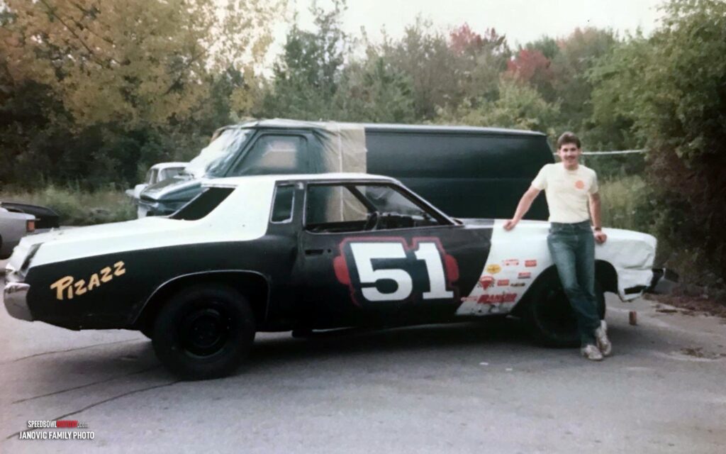 Black and white abstract pattern with concentric circles and wave shapes.
