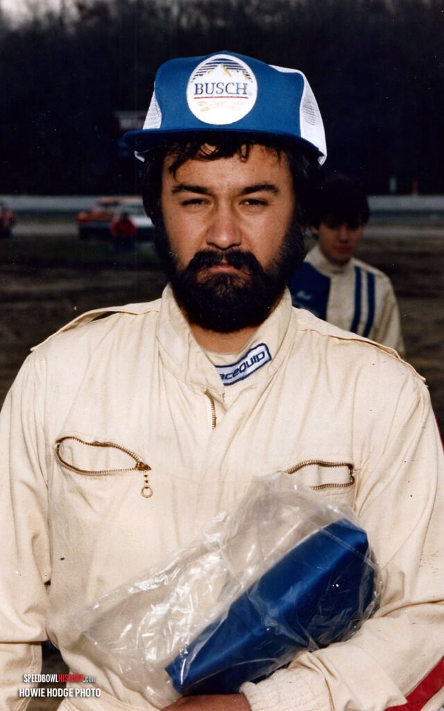 Black and white abstract pattern with concentric circles and wave shapes.