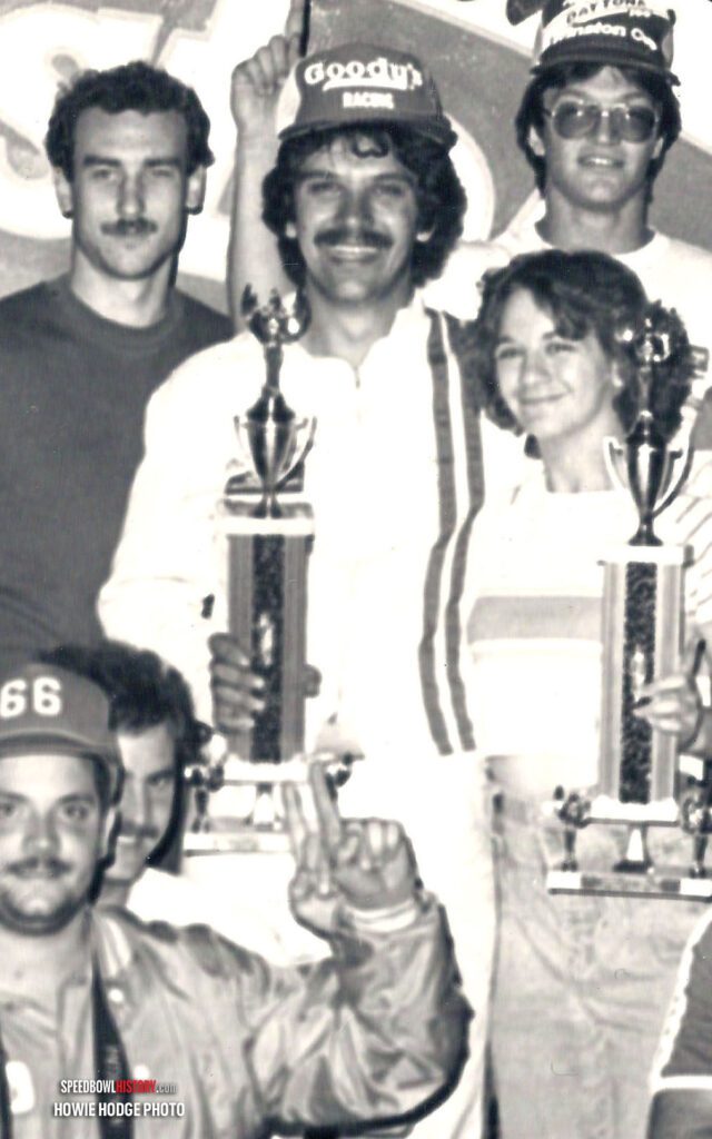 Black and white abstract pattern with concentric circles and wave shapes.