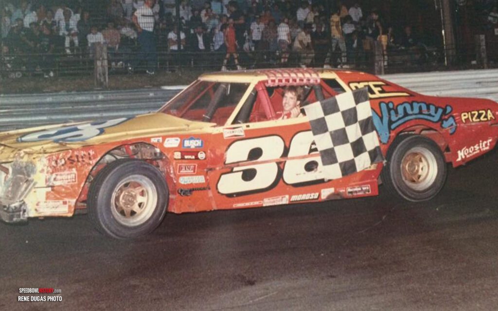 Black and white abstract pattern with concentric circles and wave shapes.