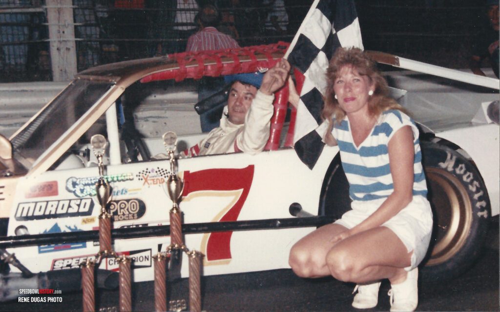 Black and white abstract pattern with concentric circles and wave shapes.