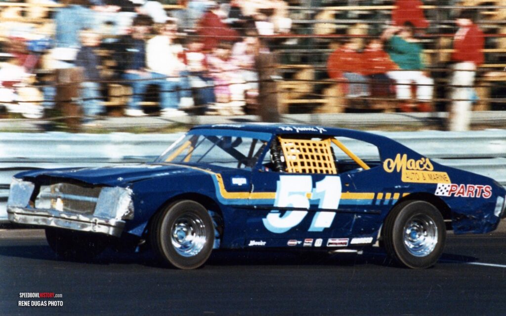 Black and white abstract pattern with concentric circles and wave shapes.