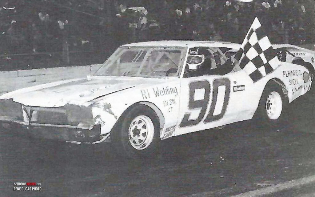 Black and white abstract pattern with concentric circles and wave shapes.