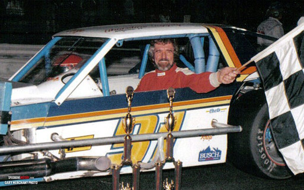 Black and white abstract pattern with concentric circles and wave shapes.