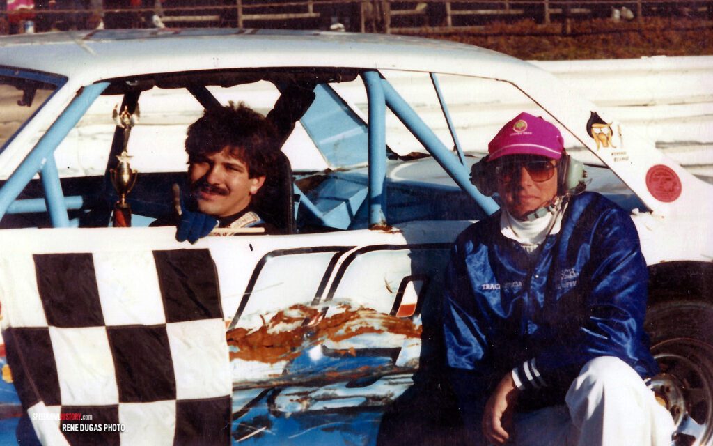 Black and white abstract pattern with concentric circles and wave shapes.