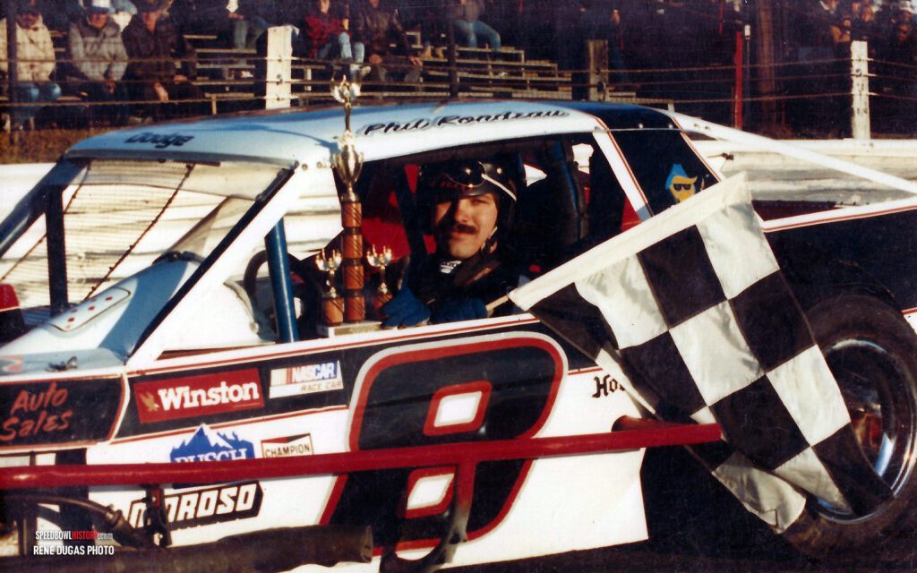 Black and white abstract pattern with concentric circles and wave shapes.