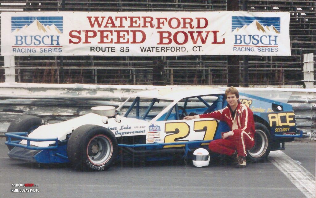 Black and white abstract pattern with concentric circles and wave shapes.