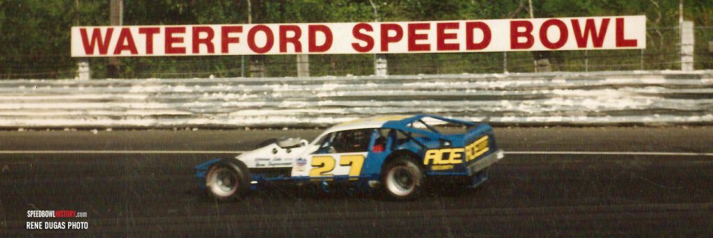 Black and white abstract pattern with concentric circles and wave shapes.