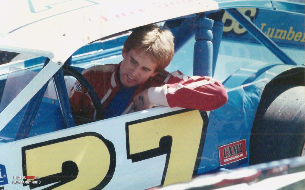 Black and white abstract pattern with concentric circles and wave shapes.