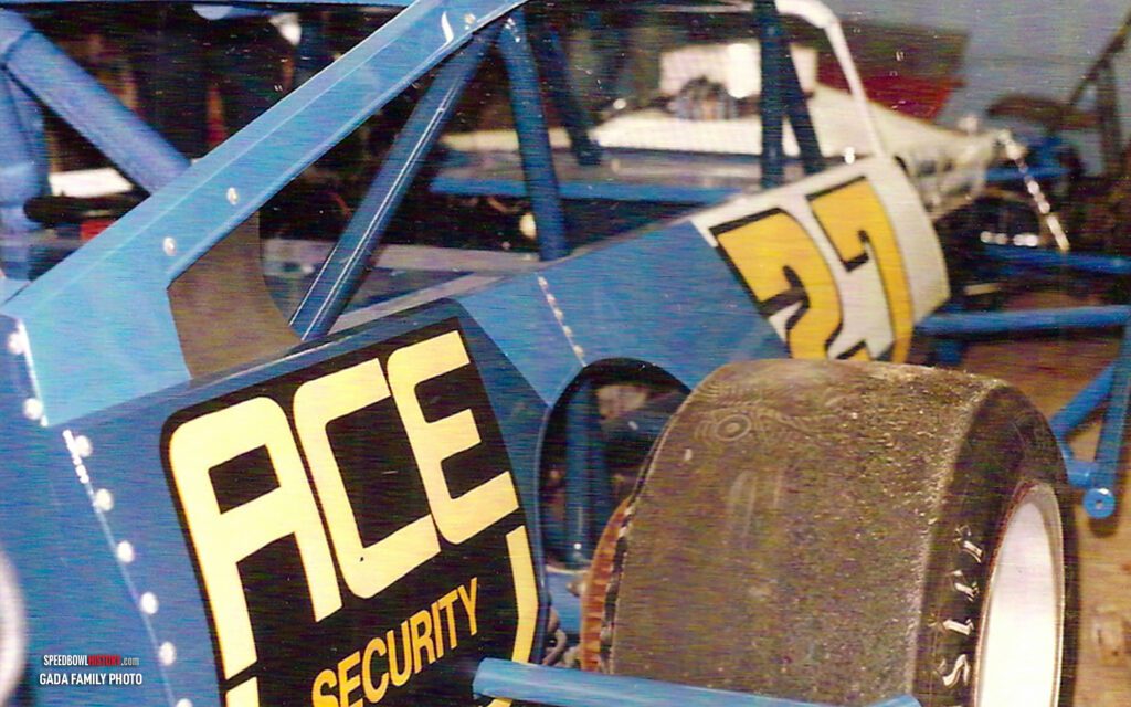 Black and white abstract pattern with concentric circles and wave shapes.