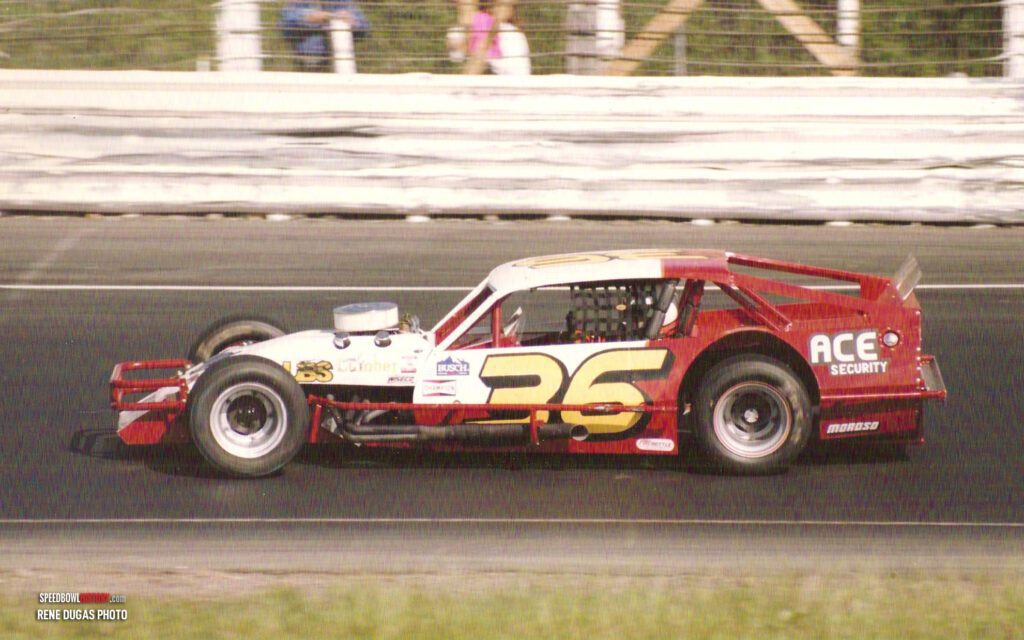 Black and white abstract pattern with concentric circles and wave shapes.