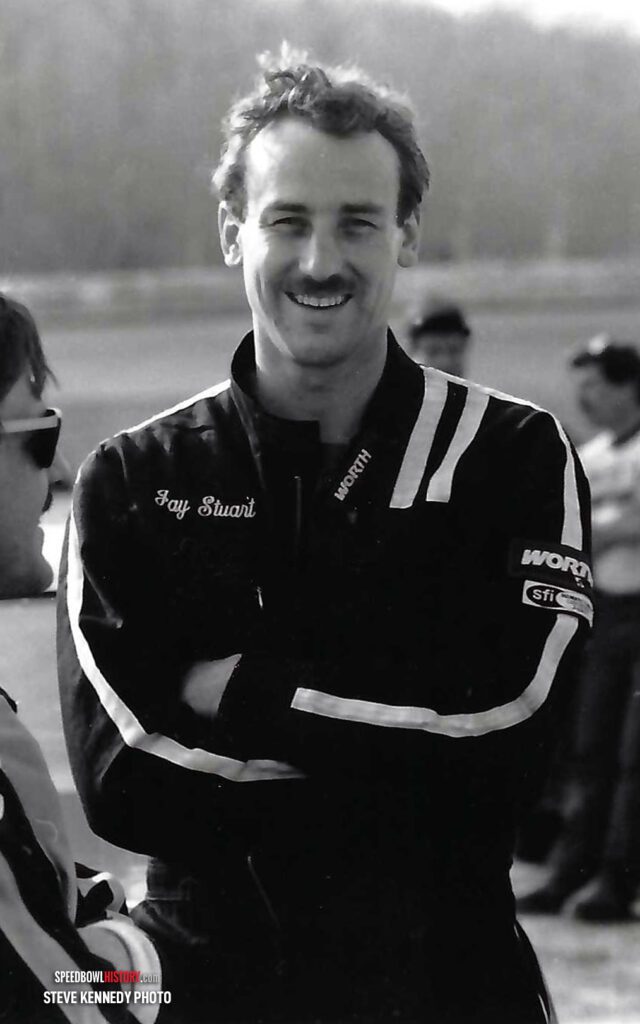 Black and white abstract pattern with concentric circles and wave shapes.