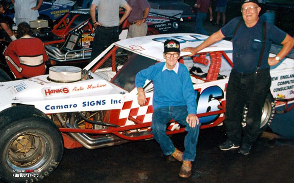 Black and white abstract pattern with concentric circles and wave shapes.