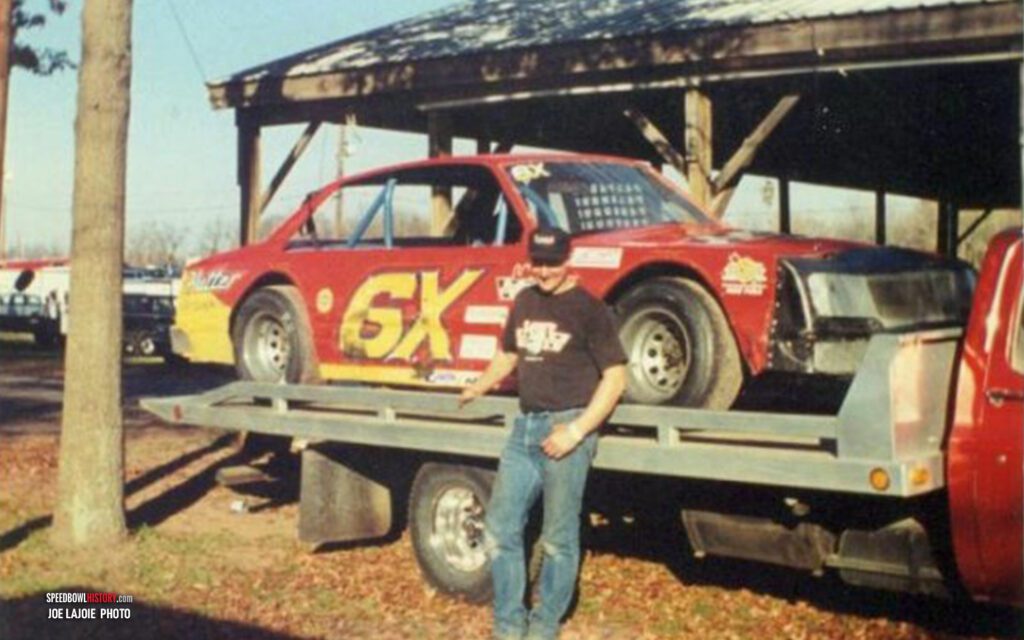 Black and white abstract pattern with concentric circles and wave shapes.