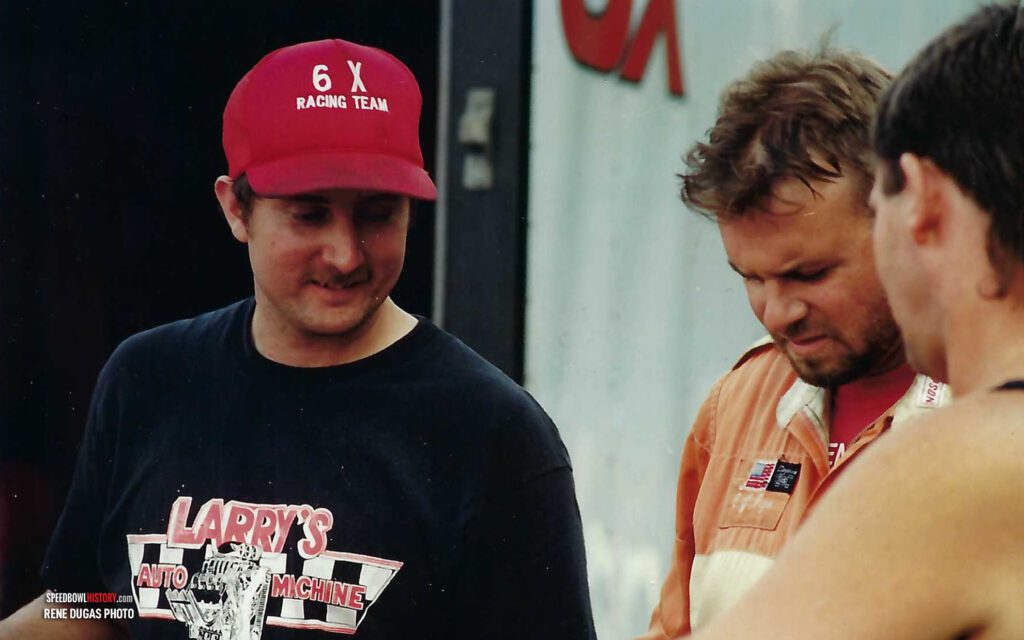 Black and white abstract pattern with concentric circles and wave shapes.