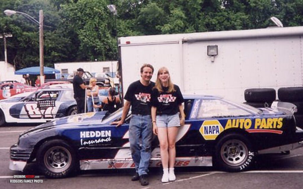 Black and white abstract pattern with concentric circles and wave shapes.