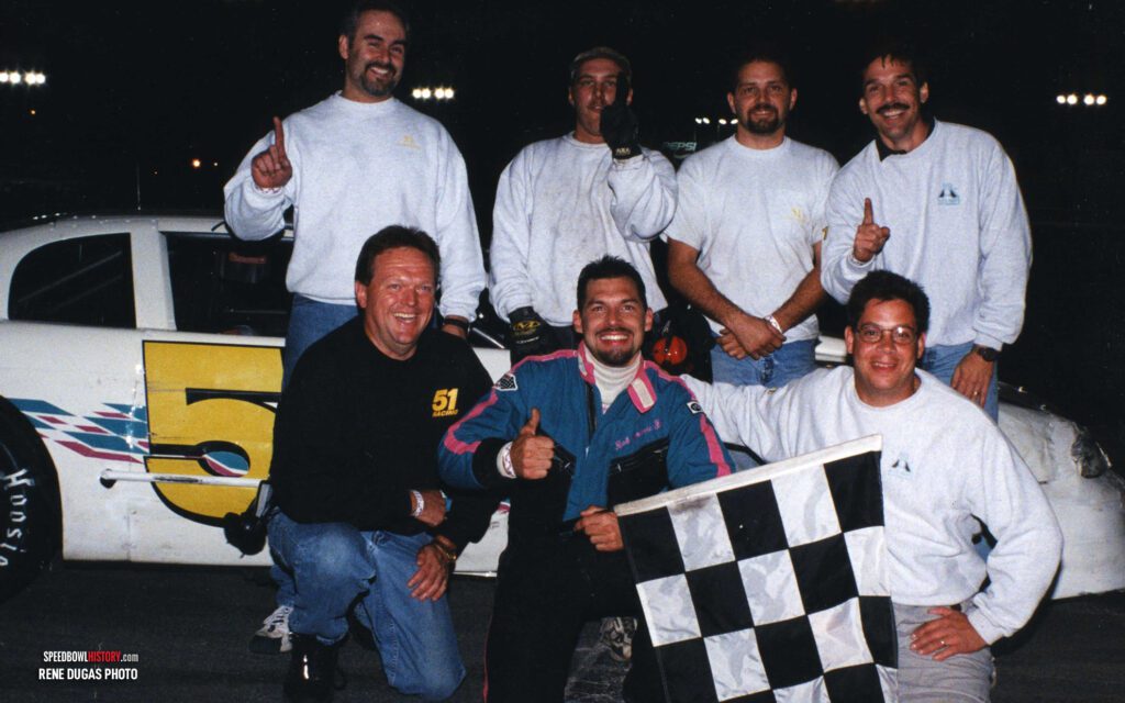 Black and white abstract pattern with concentric circles and wave shapes.