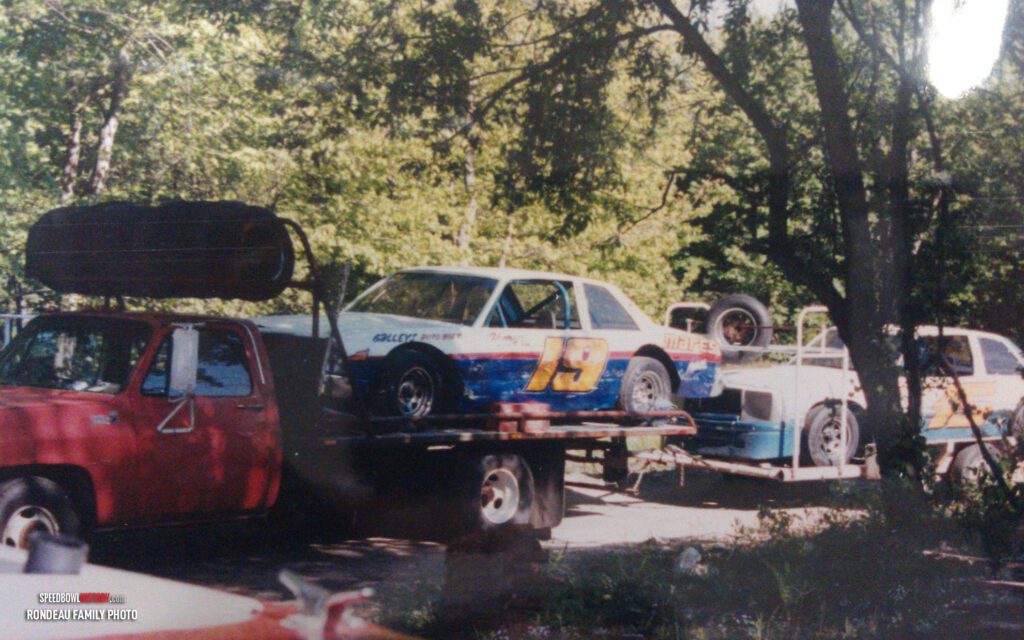 Black and white abstract pattern with concentric circles and wave shapes.