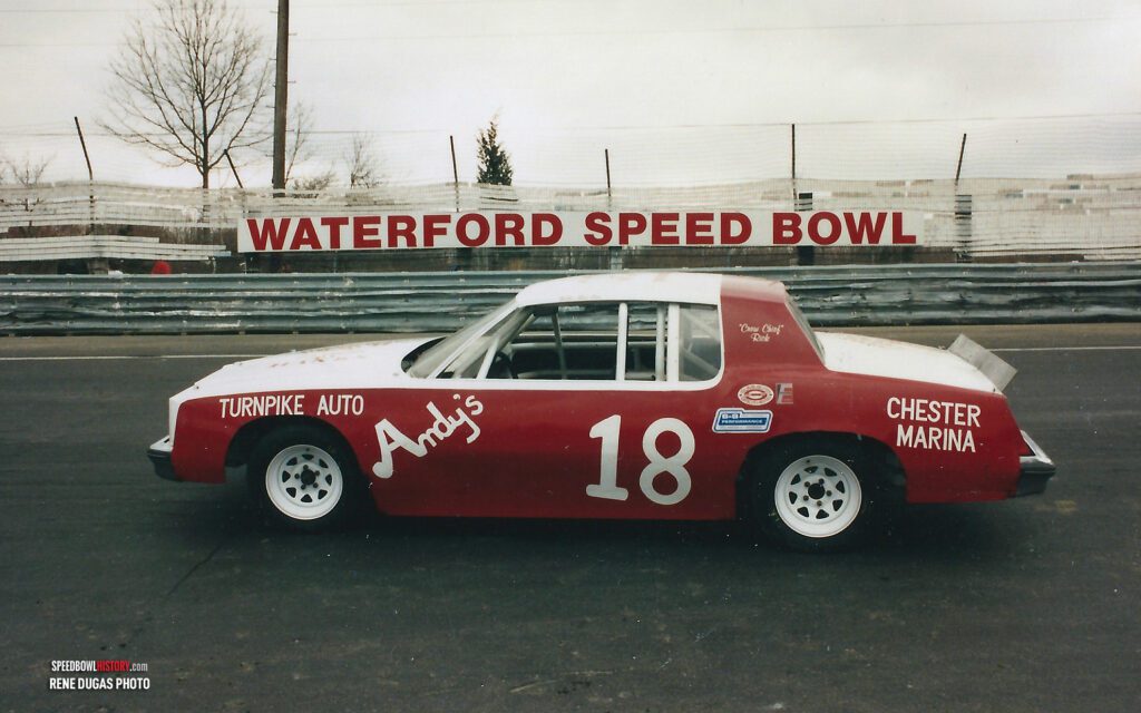 Black and white abstract pattern with concentric circles and wave shapes.