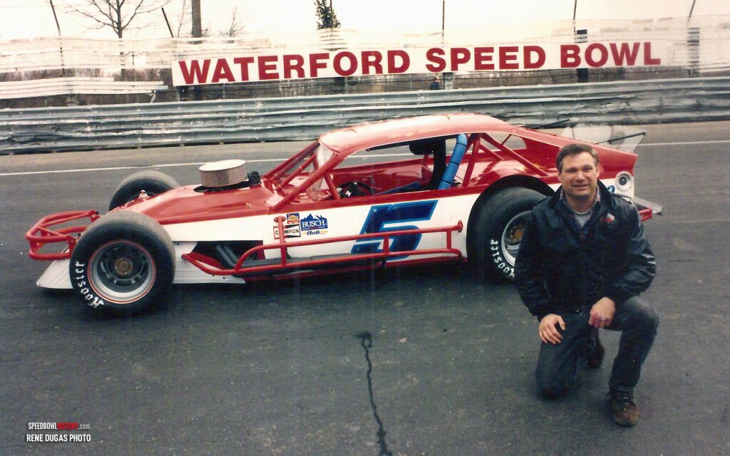 Black and white abstract pattern with concentric circles and wave shapes.