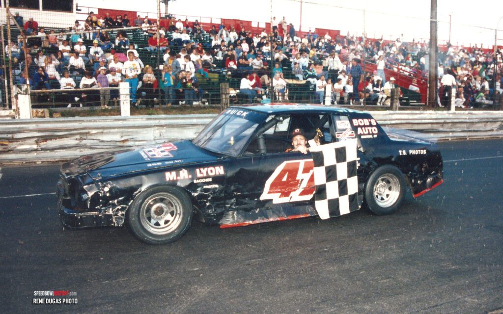 Black and white abstract pattern with concentric circles and wave shapes.