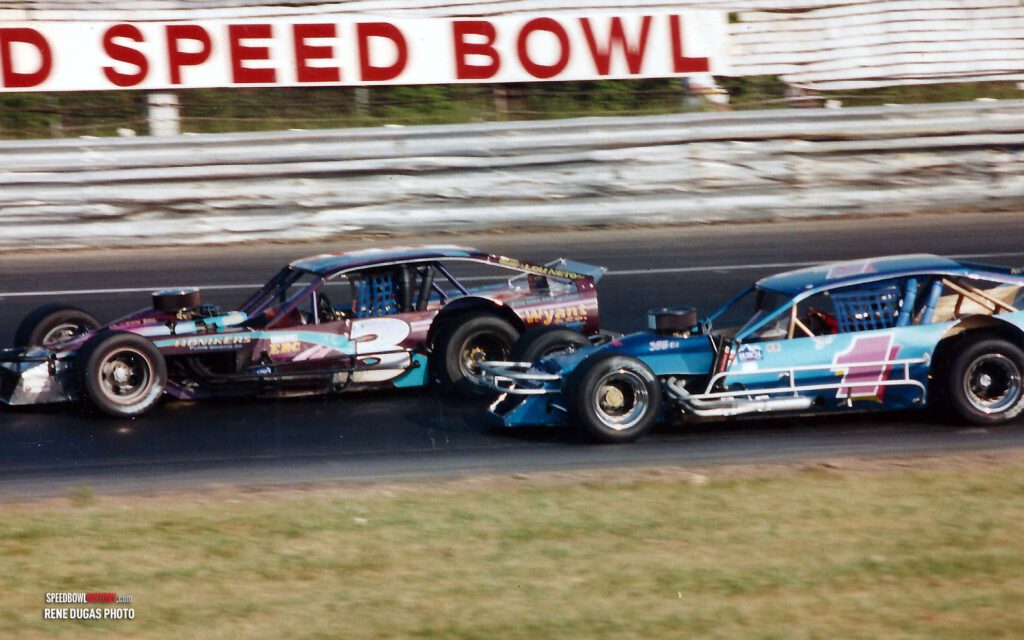 Black and white abstract pattern with concentric circles and wave shapes.
