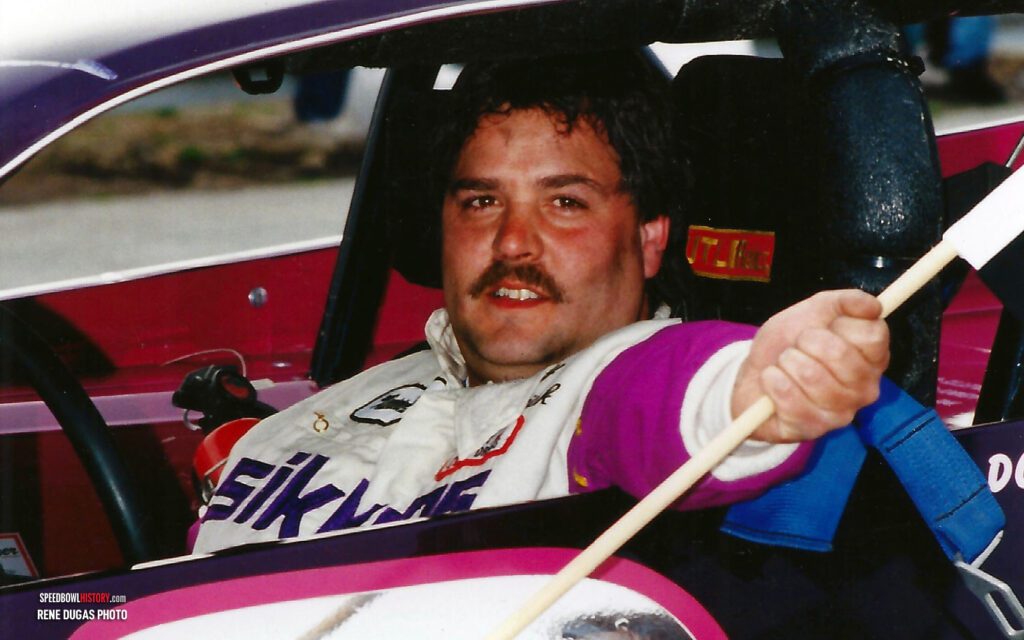 Black and white abstract pattern with concentric circles and wave shapes.