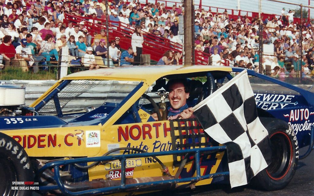 Black and white abstract pattern with concentric circles and wave shapes.