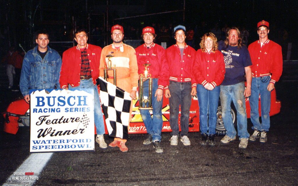 Black and white abstract pattern with concentric circles and wave shapes.