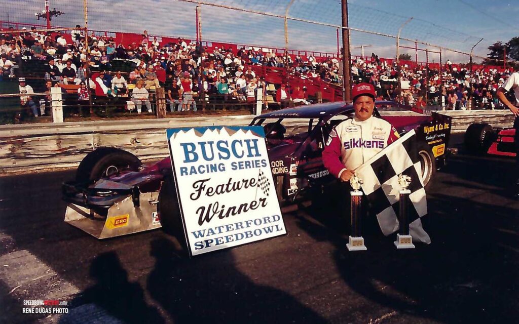 Black and white abstract pattern with concentric circles and wave shapes.