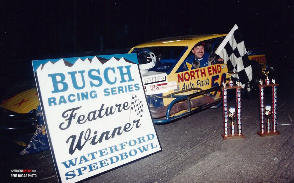 Black and white abstract pattern with concentric circles and wave shapes.