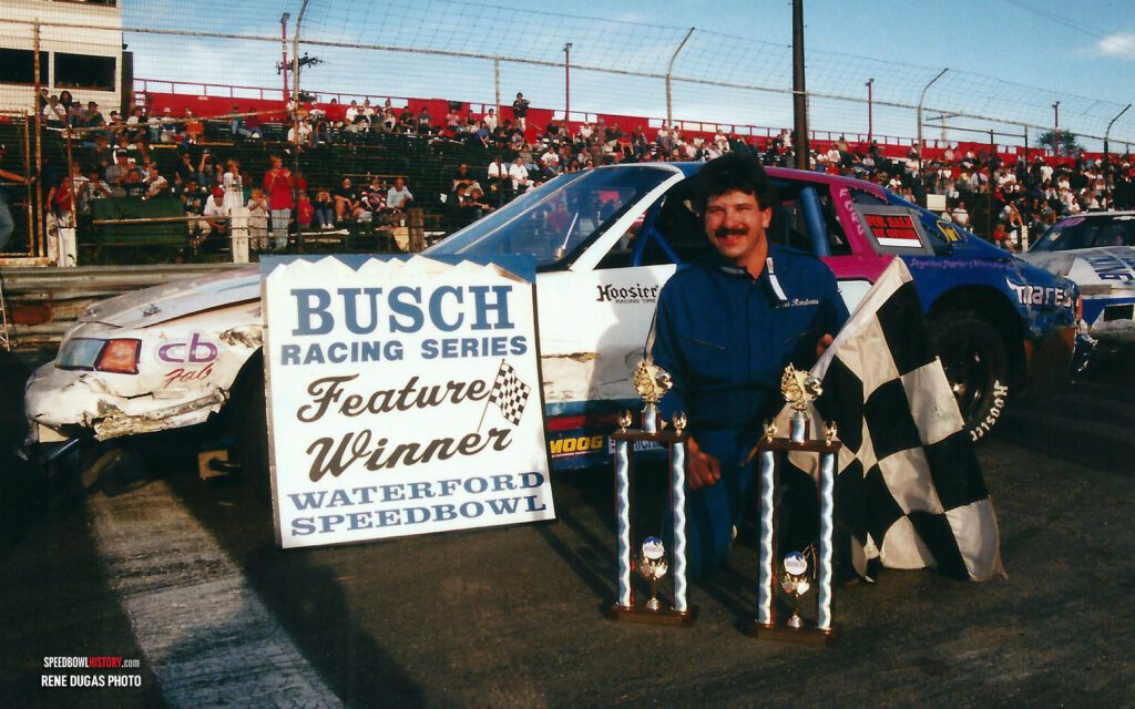 Black and white abstract pattern with concentric circles and wave shapes.