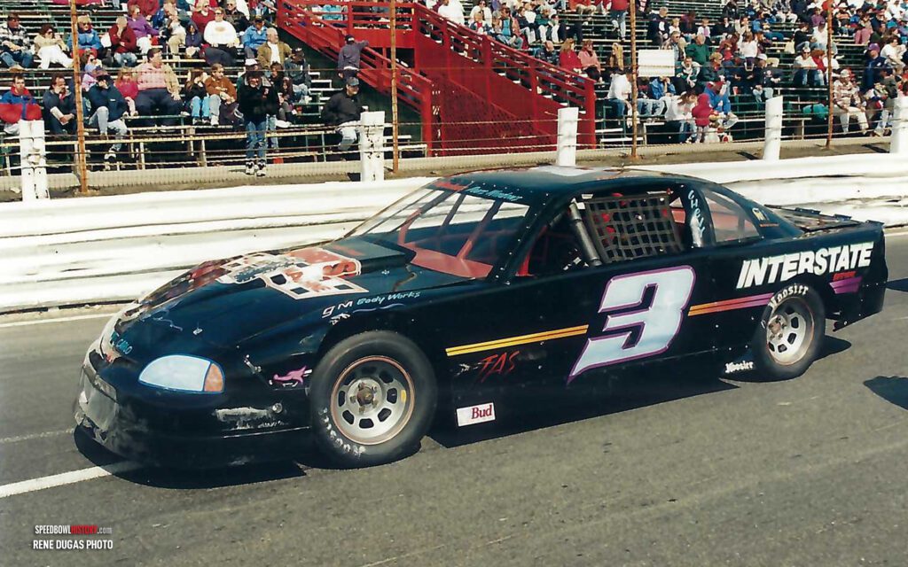 Black and white abstract pattern with concentric circles and wave shapes.