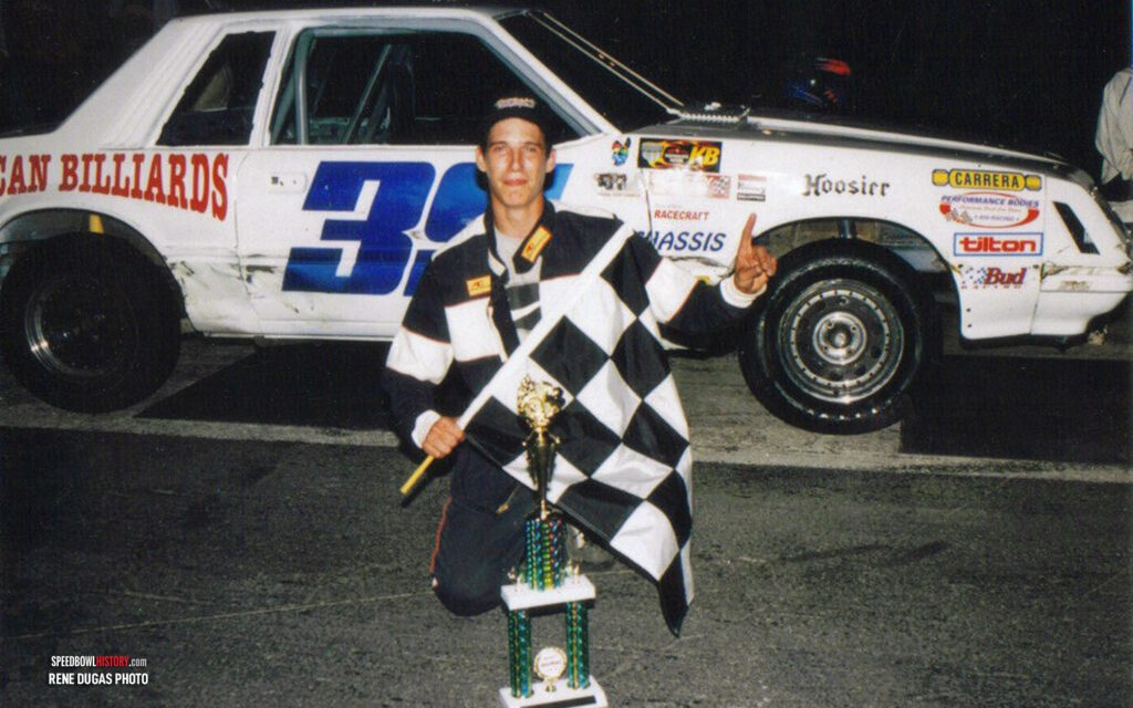 Black and white abstract pattern with concentric circles and wave shapes.