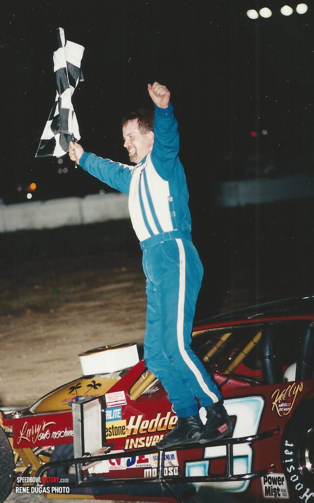 Black and white abstract pattern with concentric circles and wave shapes.