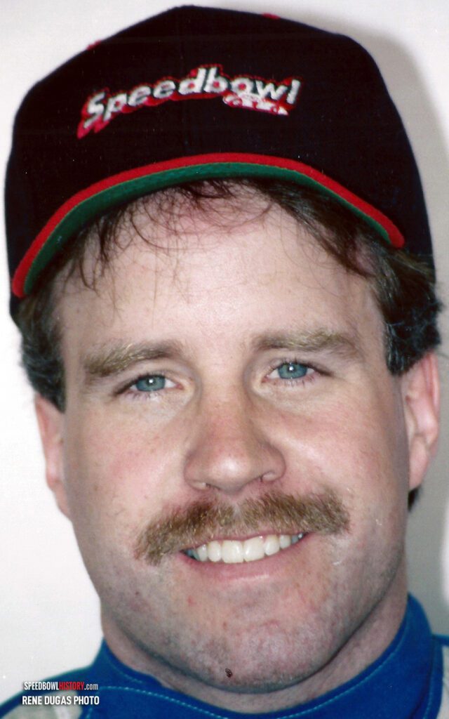 Black and white abstract pattern with concentric circles and wave shapes.