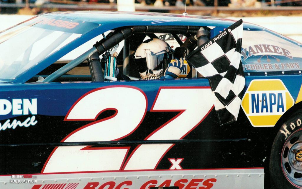 Black and white abstract pattern with concentric circles and wave shapes.