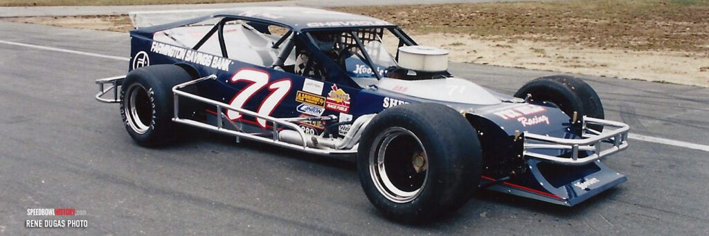 Black and white abstract pattern with concentric circles and wave shapes.