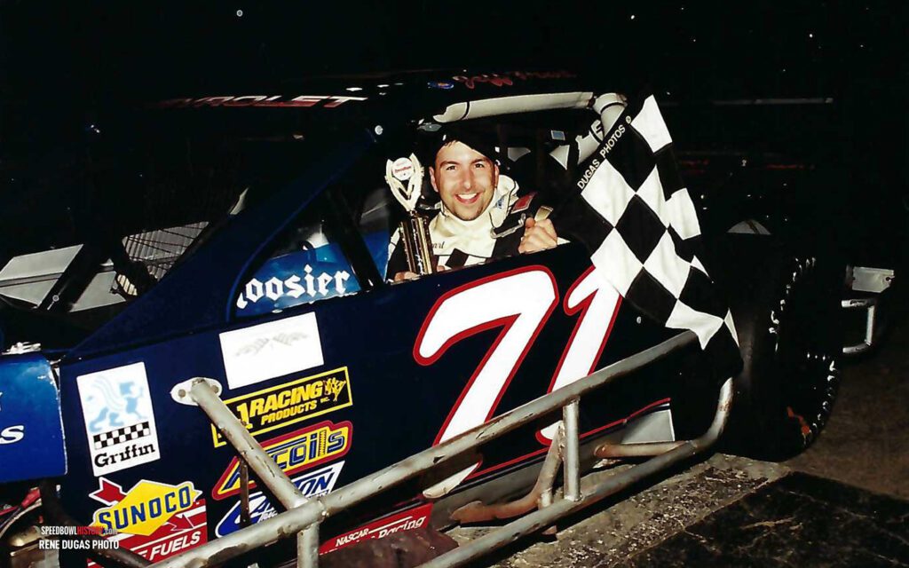 Black and white abstract pattern with concentric circles and wave shapes.