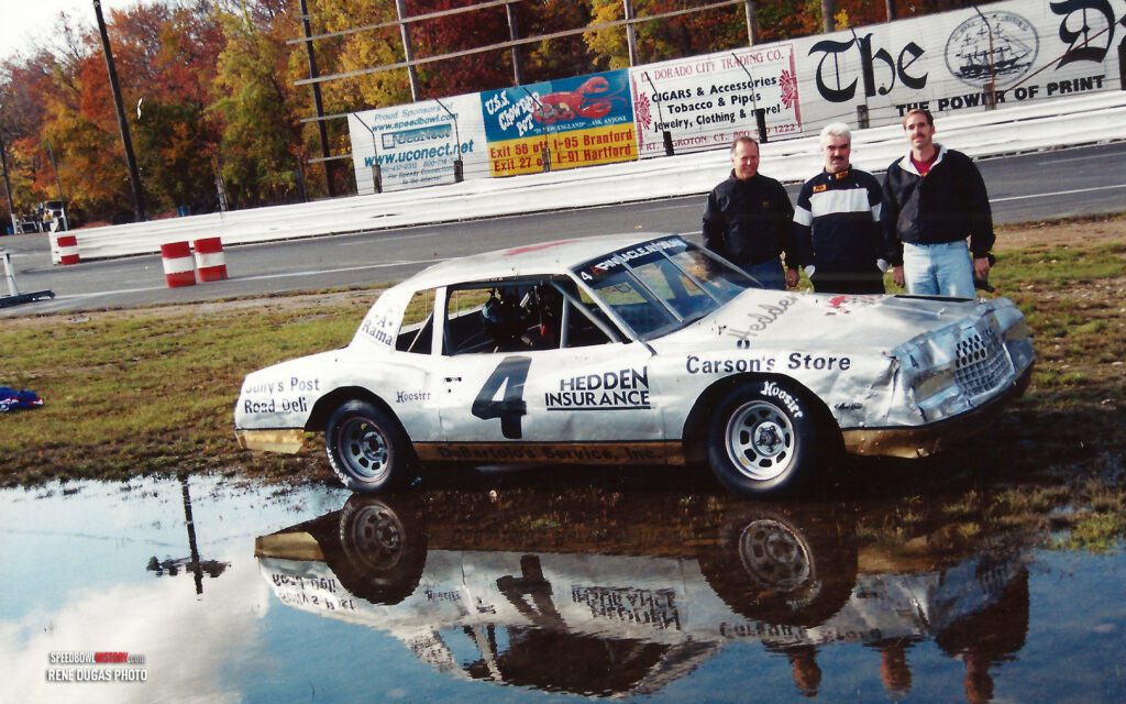 Black and white abstract pattern with concentric circles and wave shapes.