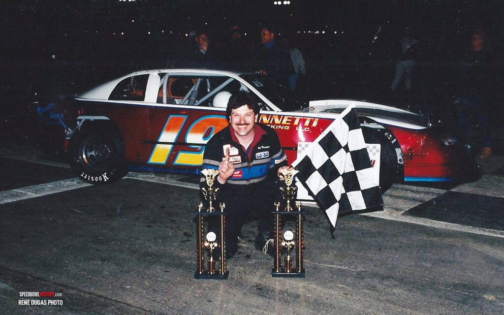 Black and white abstract pattern with concentric circles and wave shapes.