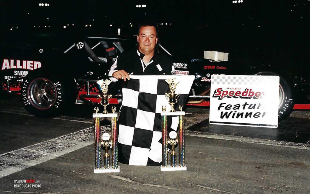 Black and white abstract pattern with concentric circles and wave shapes.