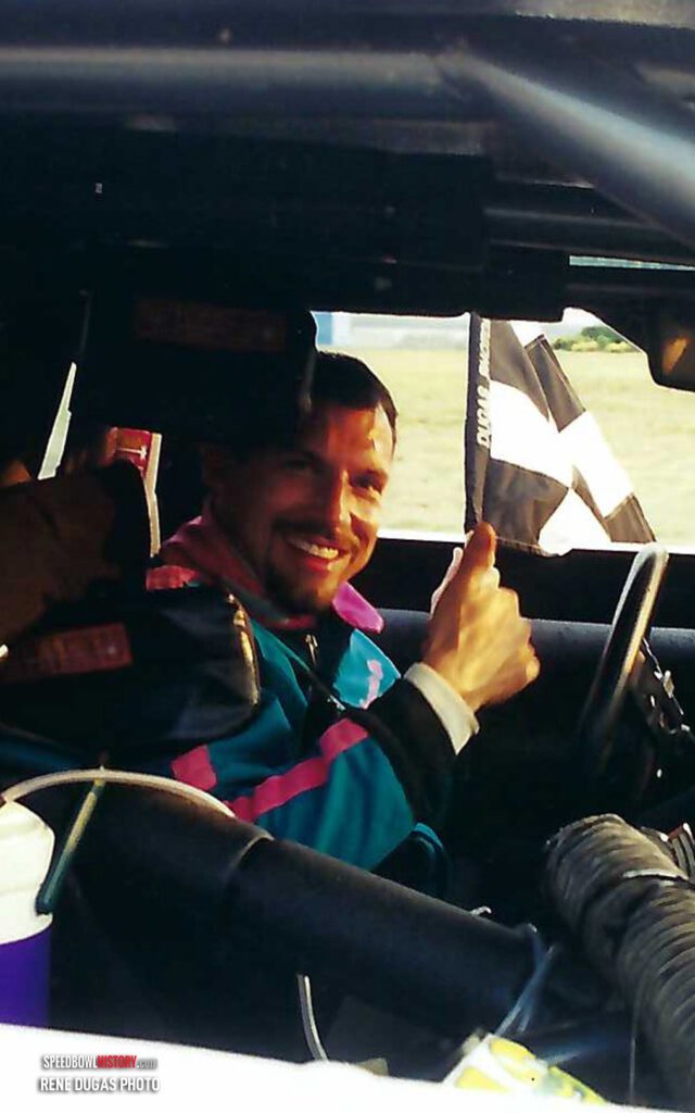 Black and white abstract pattern with concentric circles and wave shapes.