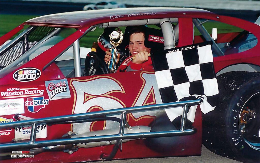 Black and white abstract pattern with concentric circles and wave shapes.