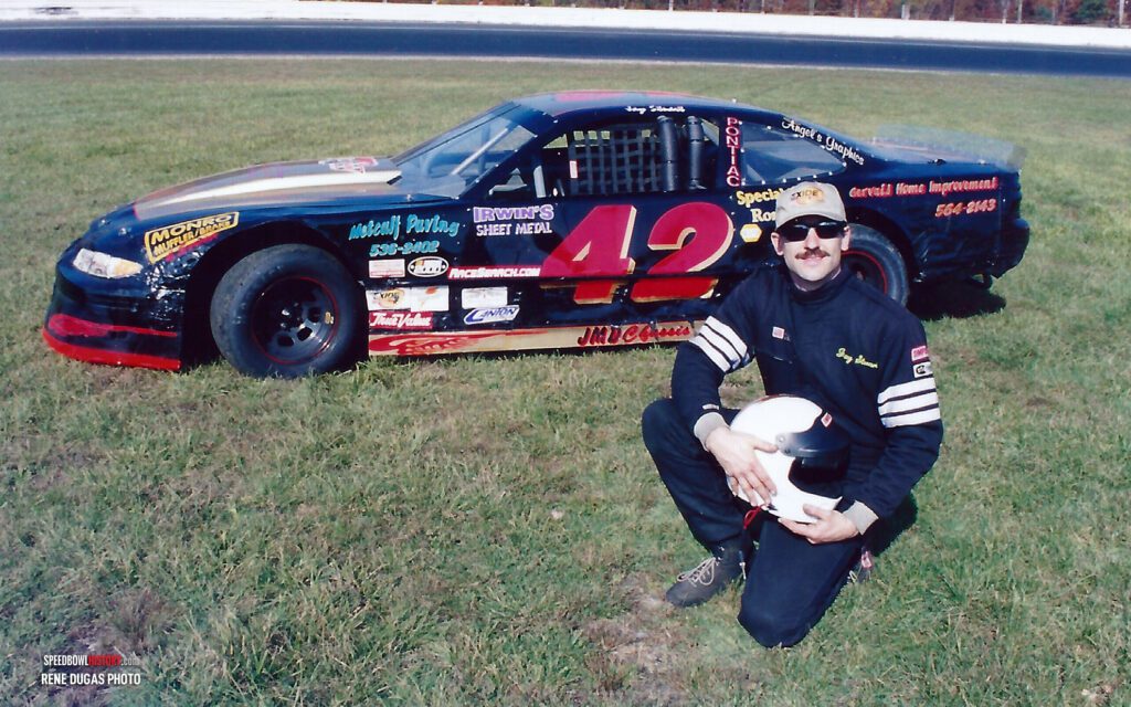 Black and white abstract pattern with concentric circles and wave shapes.