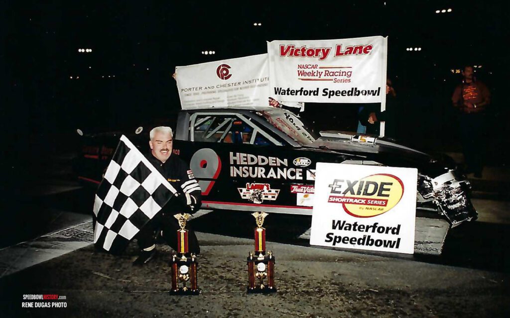 Black and white abstract pattern with concentric circles and wave shapes.