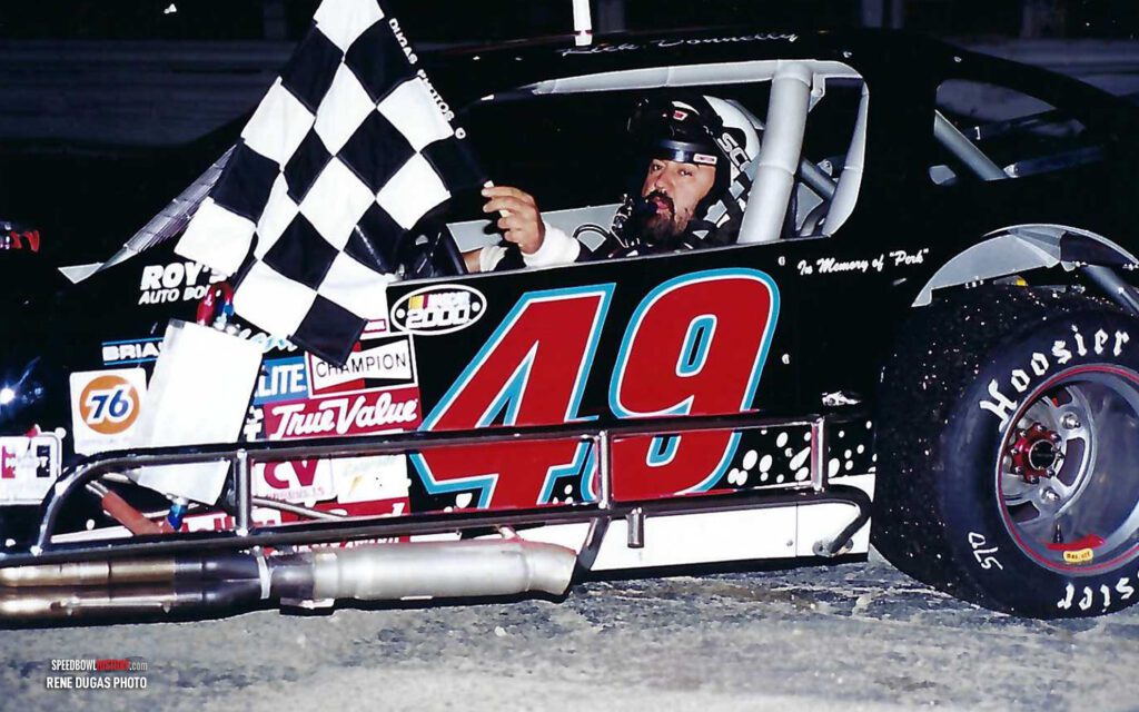 Black and white abstract pattern with concentric circles and wave shapes.