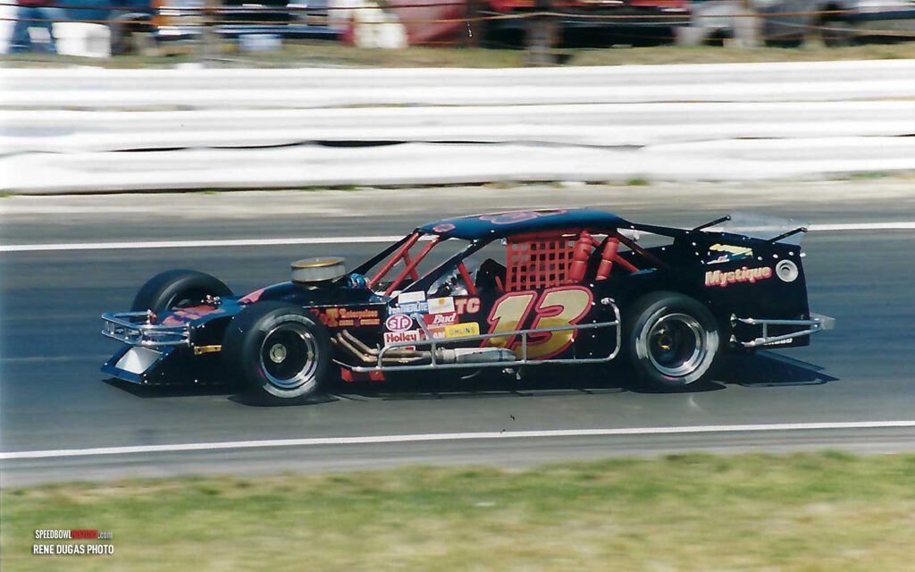 Black and white abstract pattern with concentric circles and wave shapes.